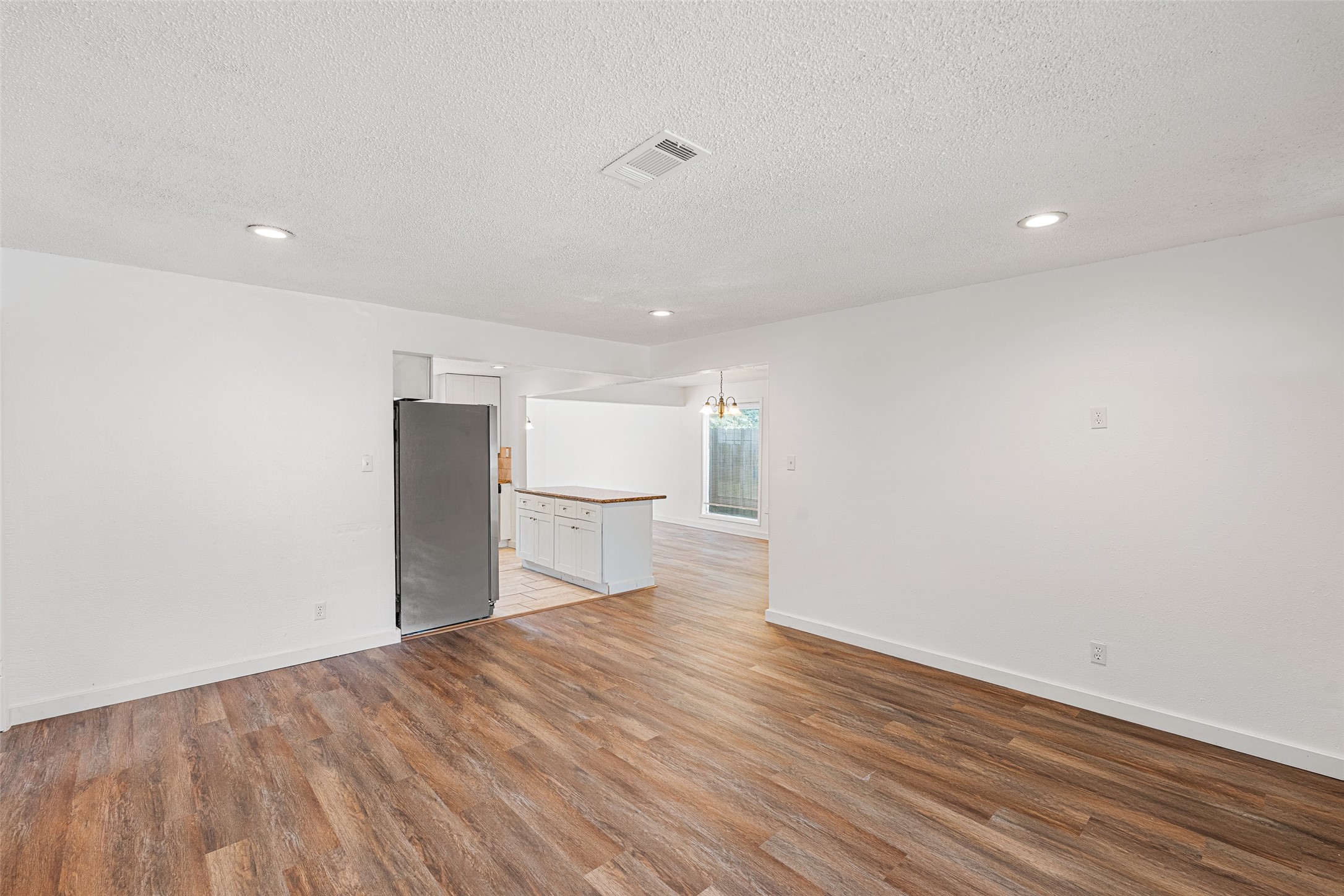 9005 Gabriel Street Houston, TX 77063 - Photo 2 of 21 a view of empty room with wooden floor