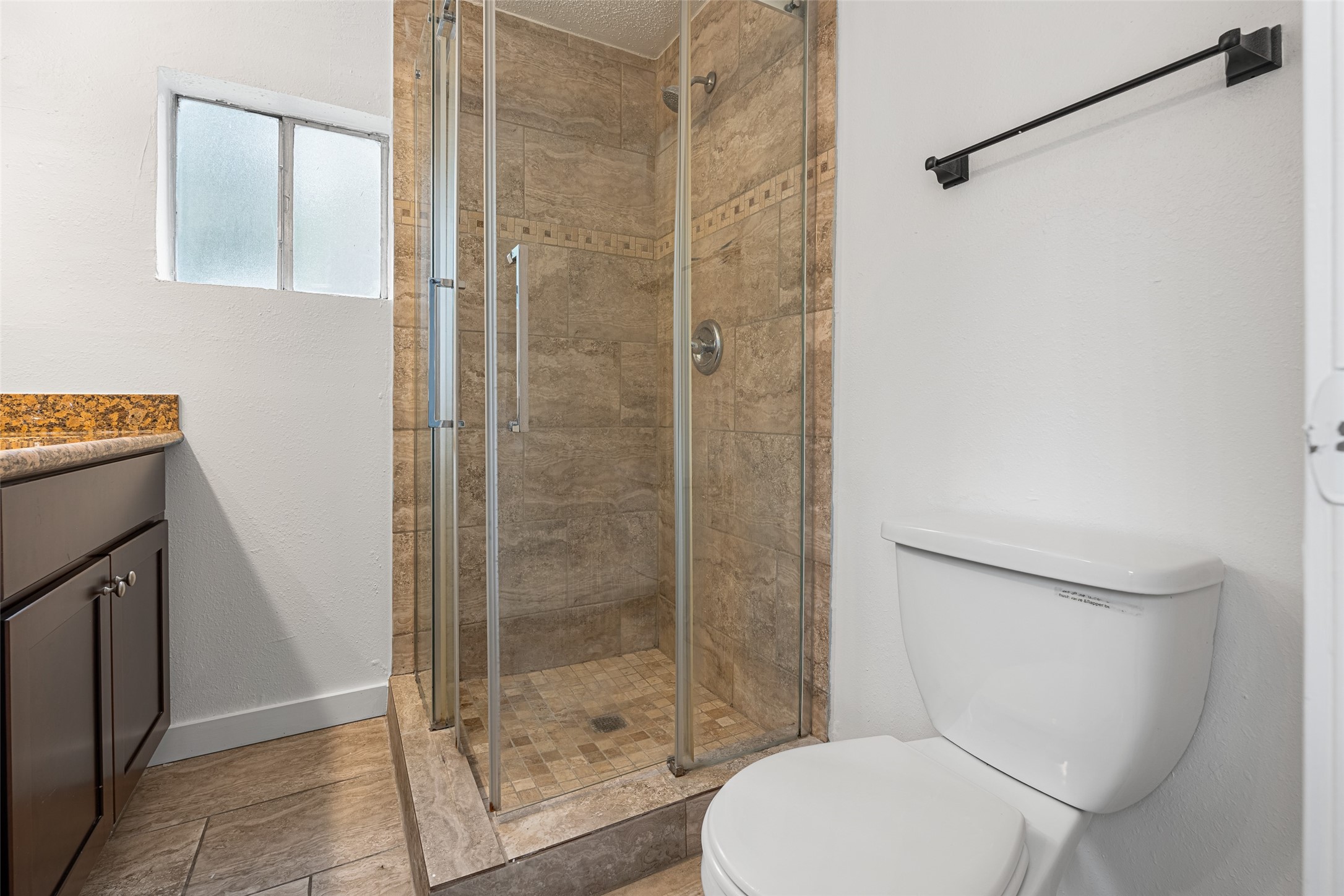 9005 Gabriel Street Houston, TX 77063 - Photo 9 of 21 a bathroom with a toilet and a shower