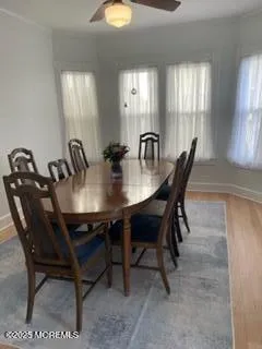 a kitchen with stainless steel appliances granite countertop a stove a sink and a white cabinets