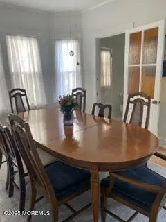 a metallic refrigerator freezer sitting in a kitchen