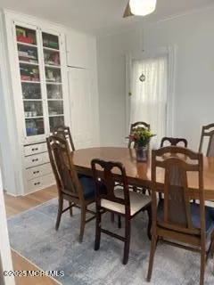 a kitchen with a stove and white cabinets