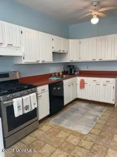 a bathroom with a toilet a sink and shower