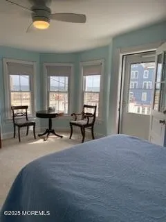 a spacious bedroom with a bed and a window