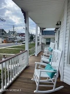 a view of a balcony with chairs