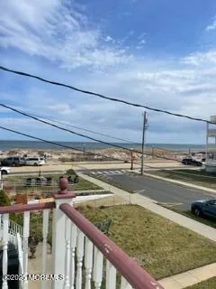 a bathroom with a granite countertop sink a toilet and a mirror