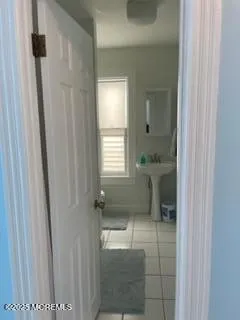 a view of room with window and cabinet