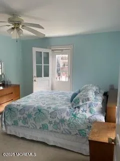 a bedroom with bed and window