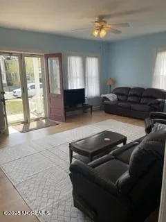 a living room with furniture and a window