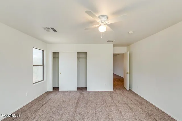 an empty room that has a window