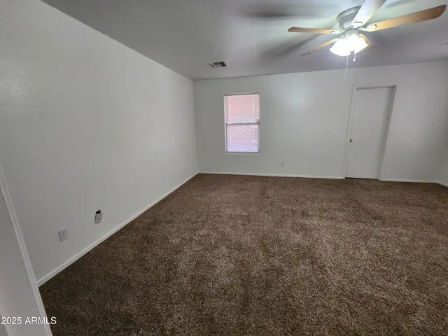 a view of a livingroom with wooden floor