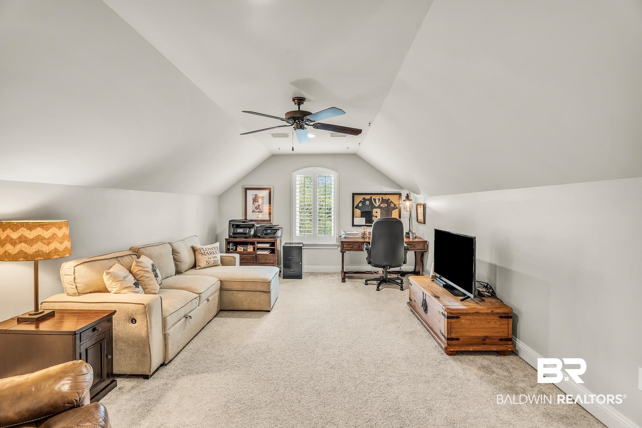 7696 Raegan Lane Daphne, AL 36527 - Photo 29 of 41 Carpeted living room with ceiling fan and vaulted ceiling