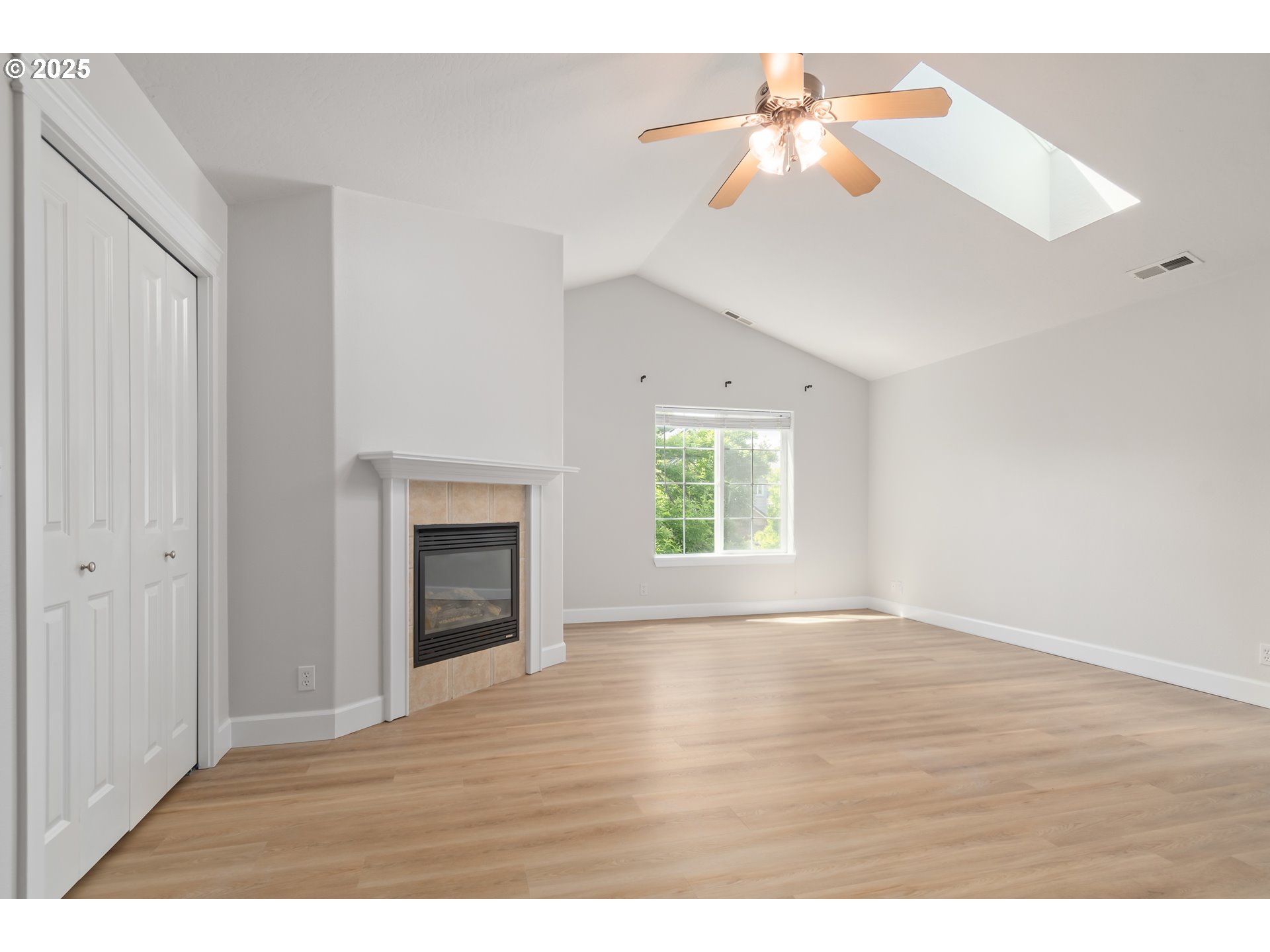 2795 Mallory Lane Eugene, OR 97401 - Photo 18 of 44 a view of an empty room with window and wooden floor