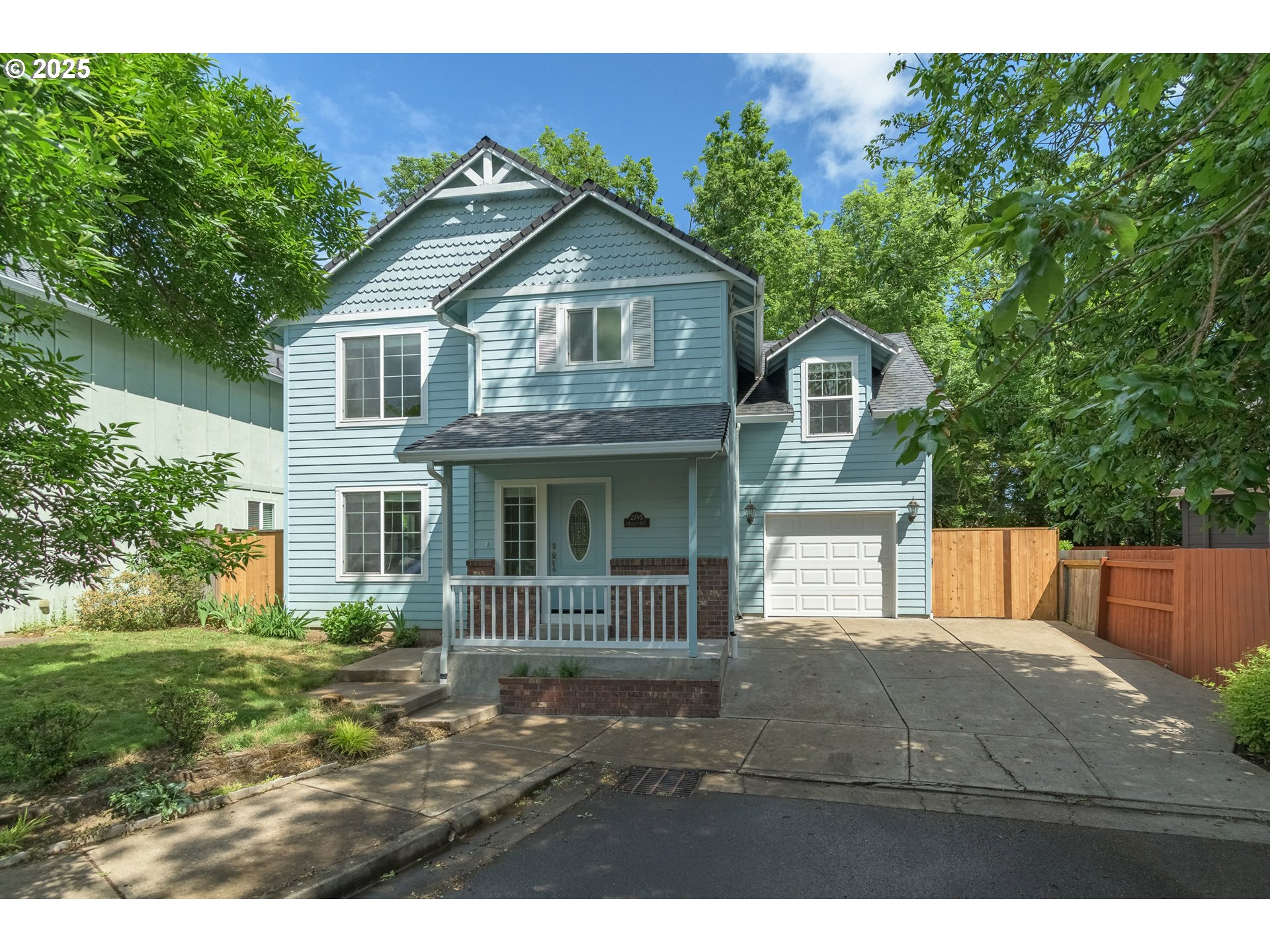 2795 Mallory Lane Eugene, OR 97401 - Photo 2 of 44 a front view of a house with a garden