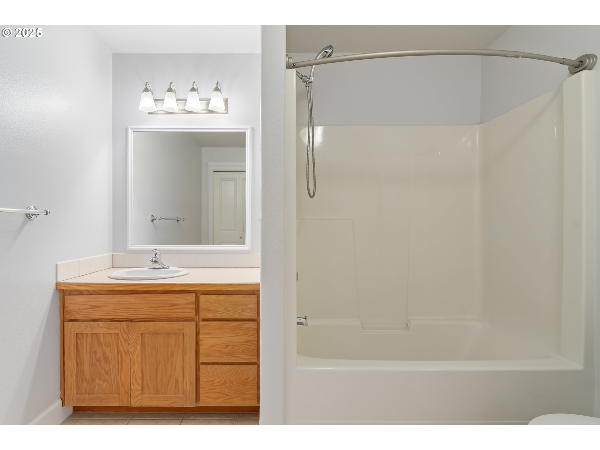 2795 Mallory Lane Eugene, OR 97401 - Photo 27 of 44 a bathroom with a sink vanity and mirror