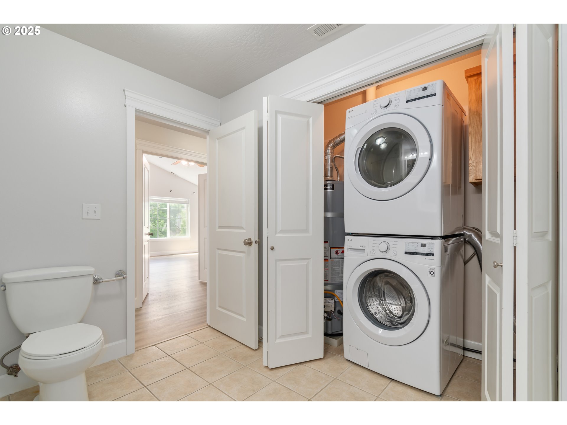2795 Mallory Lane Eugene, OR 97401 - Photo 28 of 44 a view of a bathroom with washing machine and a view of bathroom