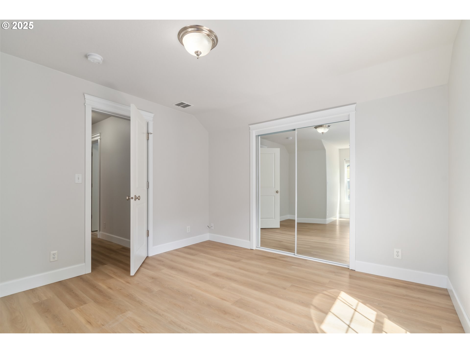 2795 Mallory Lane Eugene, OR 97401 - Photo 31 of 44 a view of an empty room with wooden floor