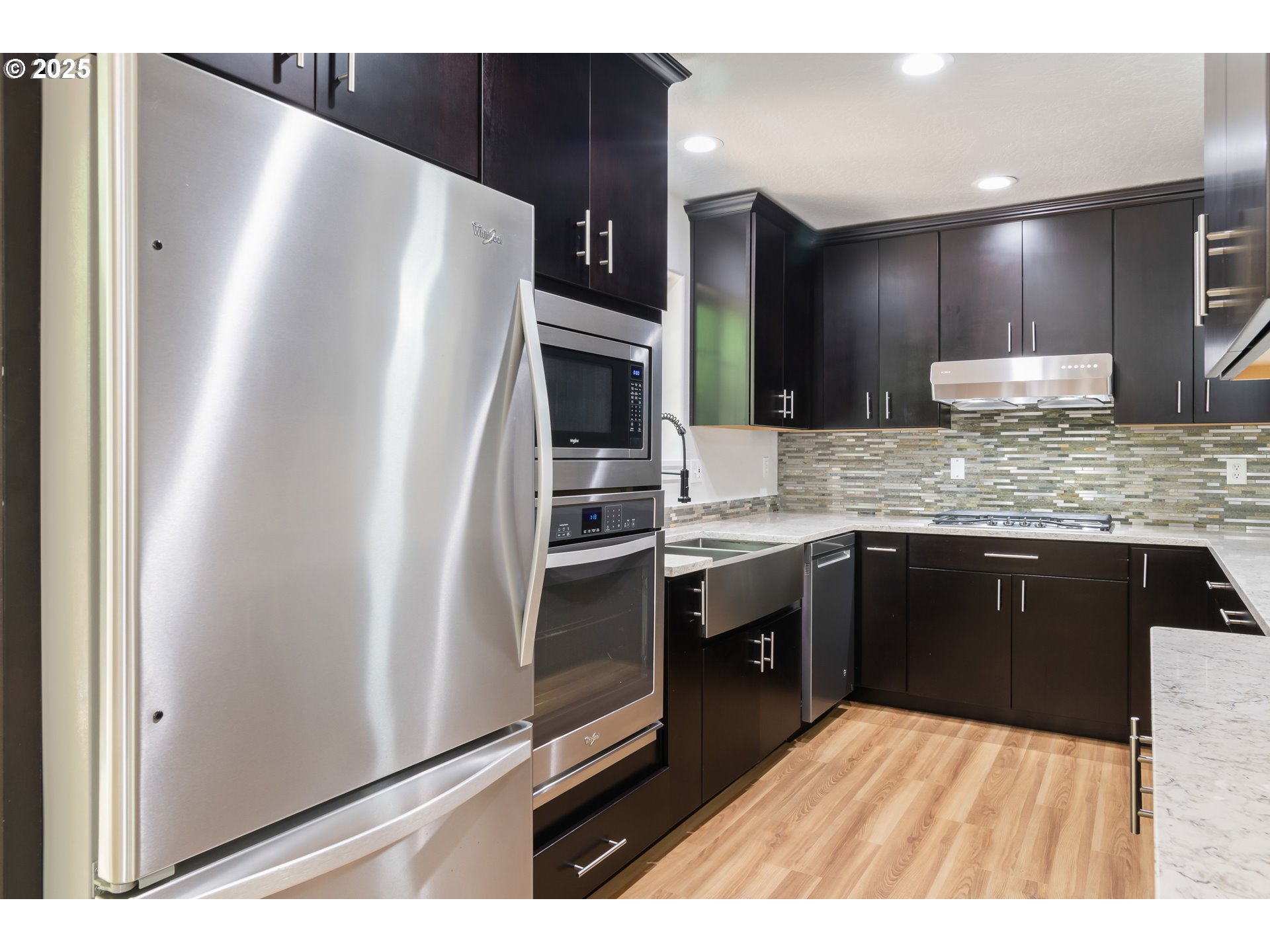 2795 Mallory Lane Eugene, OR 97401 - Photo 10 of 44 a kitchen with stainless steel appliances granite countertop a refrigerator and a sink