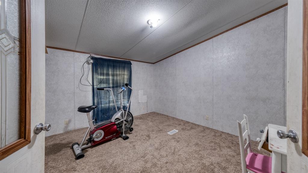 1700 Bennett Road Millsap, TX 76066 - Photo 13 of 40 a view of a room with gym equipment