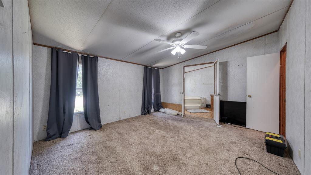 1700 Bennett Road Millsap, TX 76066 - Photo 16 of 40 an empty room with windows and closet