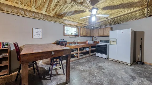 a room with furniture a chandelier and a wooden floor