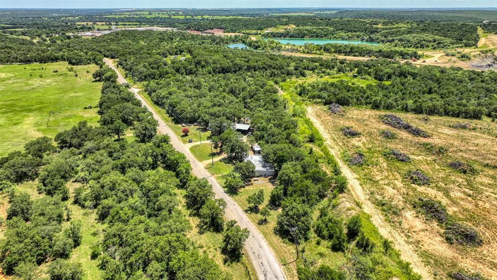 1700 Bennett Road Millsap, TX 76066 - Photo 38 of 40 an aerial view of residential houses with outdoor space and trees