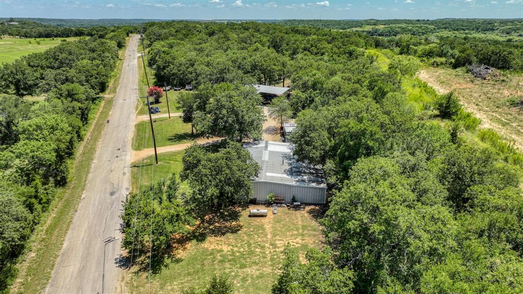 1700 Bennett Road Millsap, TX 76066 - Photo 39 of 40 an aerial view of a house with a yard and lake view