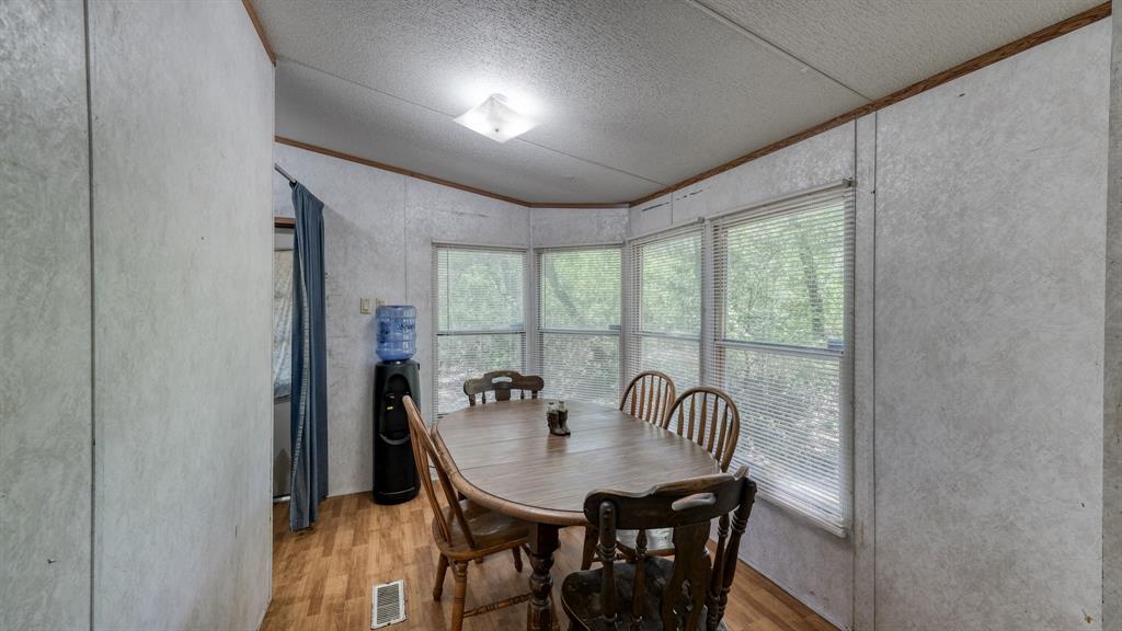 1700 Bennett Road Millsap, TX 76066 - Photo 10 of 40 a view of a dining room with furniture window and outside view