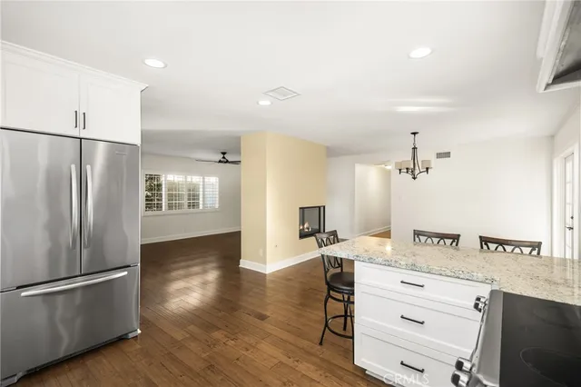 a kitchen with a refrigerator and a sink