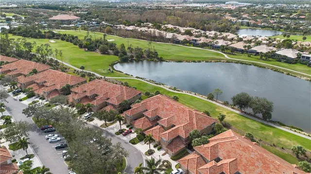 an aerial view of a house with a lake view