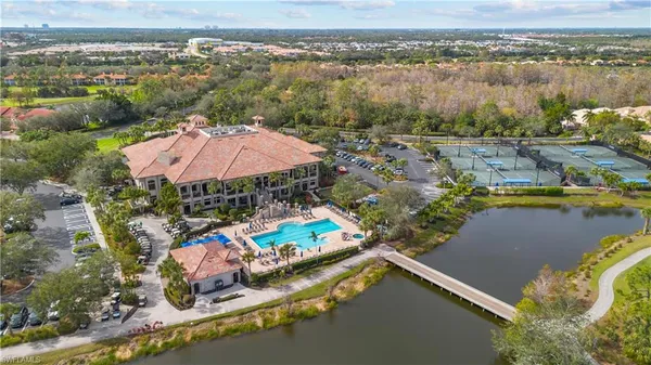 an aerial view of a house with a lake view