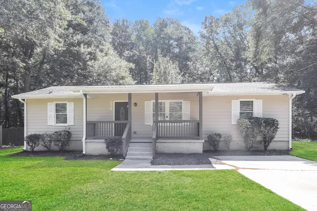 front view of a house with a yard