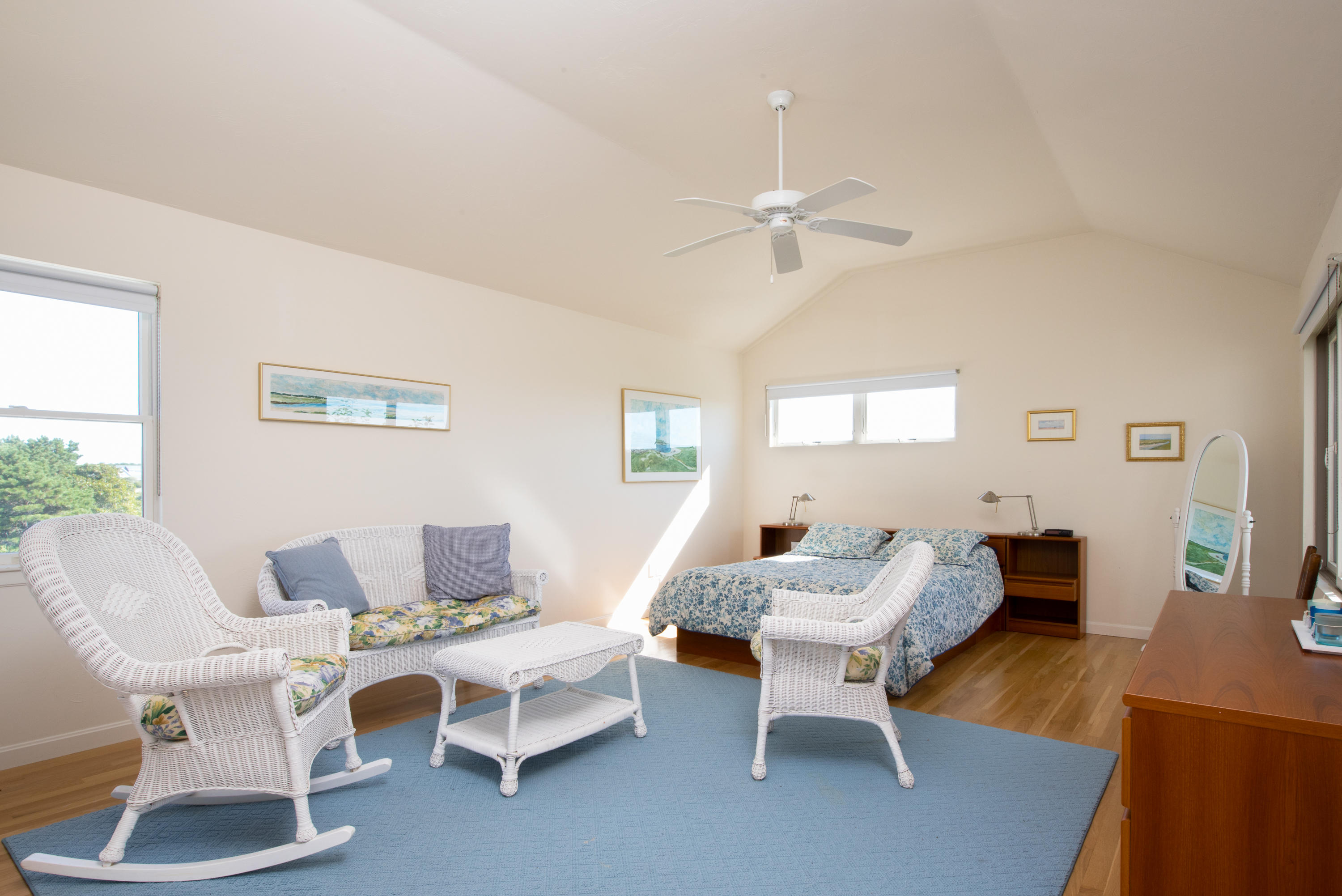 13 Avocet Road Truro, MA 02666 - Photo 18 of 35 a living room with furniture a wooden floor and a chandelier