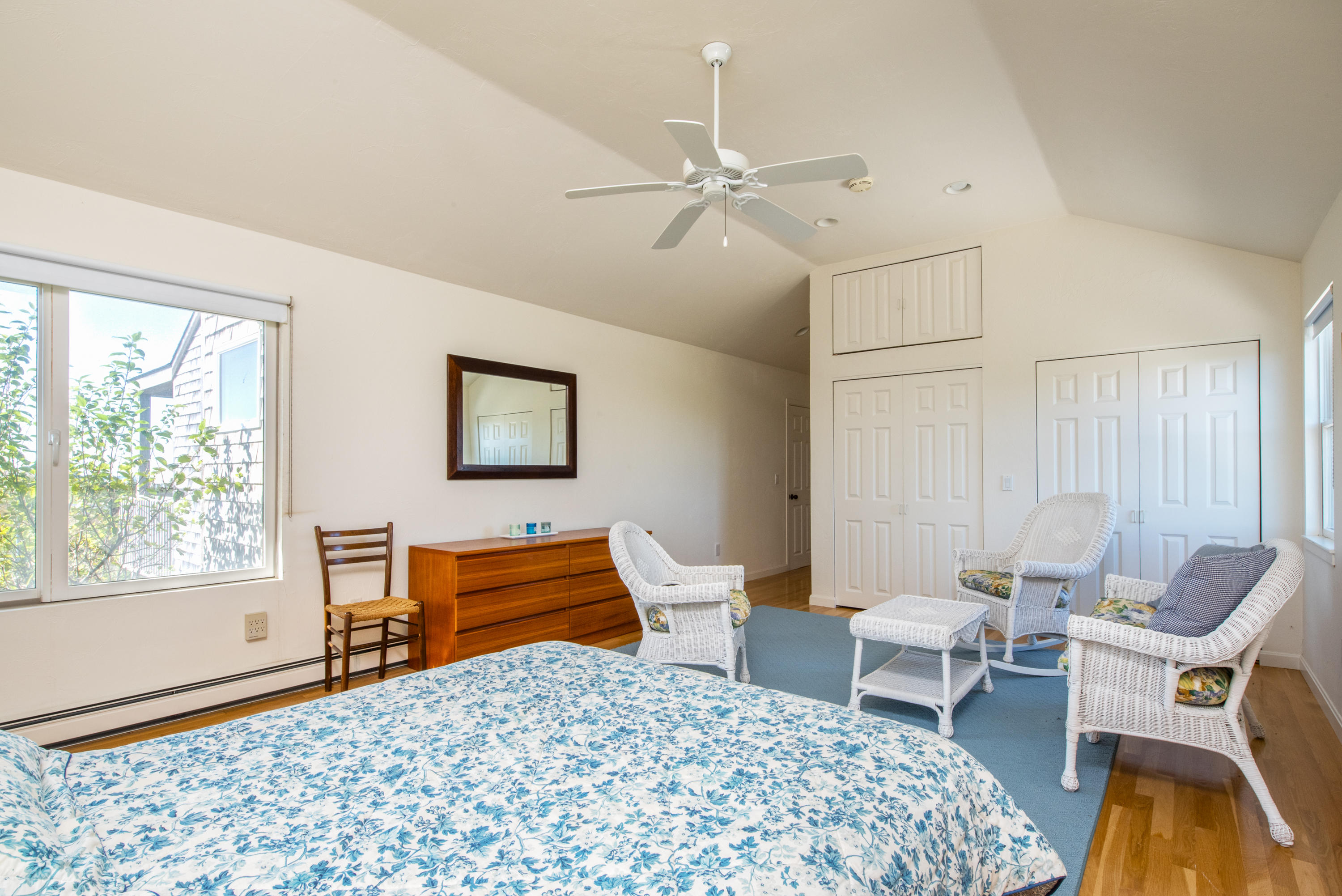 13 Avocet Road Truro, MA 02666 - Photo 19 of 35 a bedroom with a bed and wooden floor