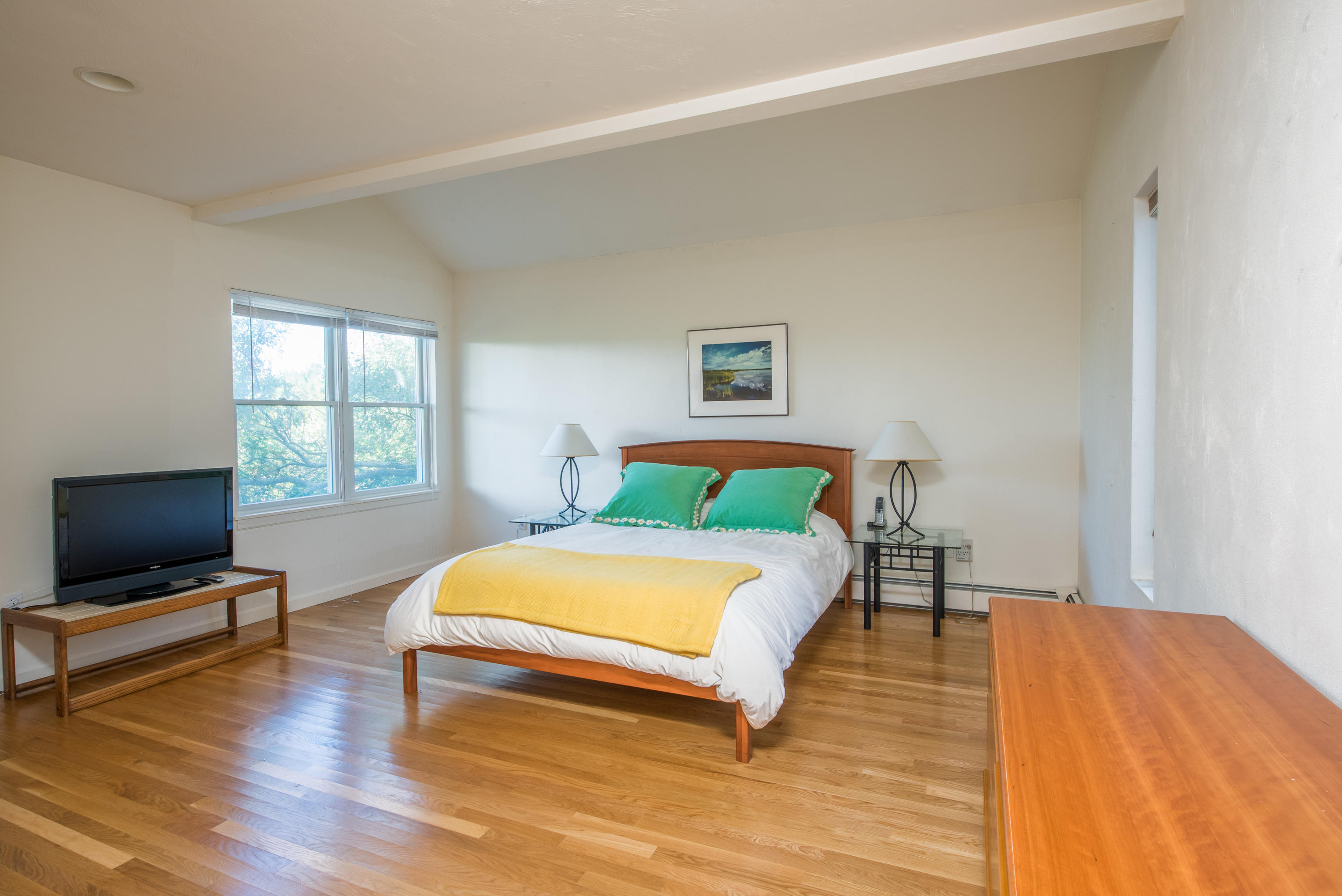 13 Avocet Road Truro, MA 02666 - Photo 23 of 35 a bedroom with a bed and wooden floor