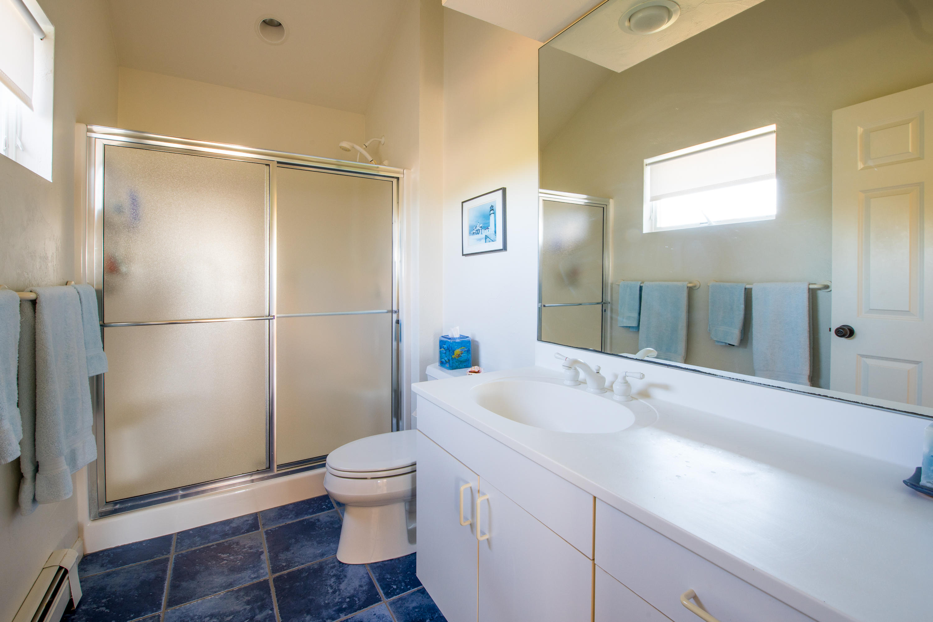 13 Avocet Road Truro, MA 02666 - Photo 25 of 35 a bathroom with a sink a toilet and shower