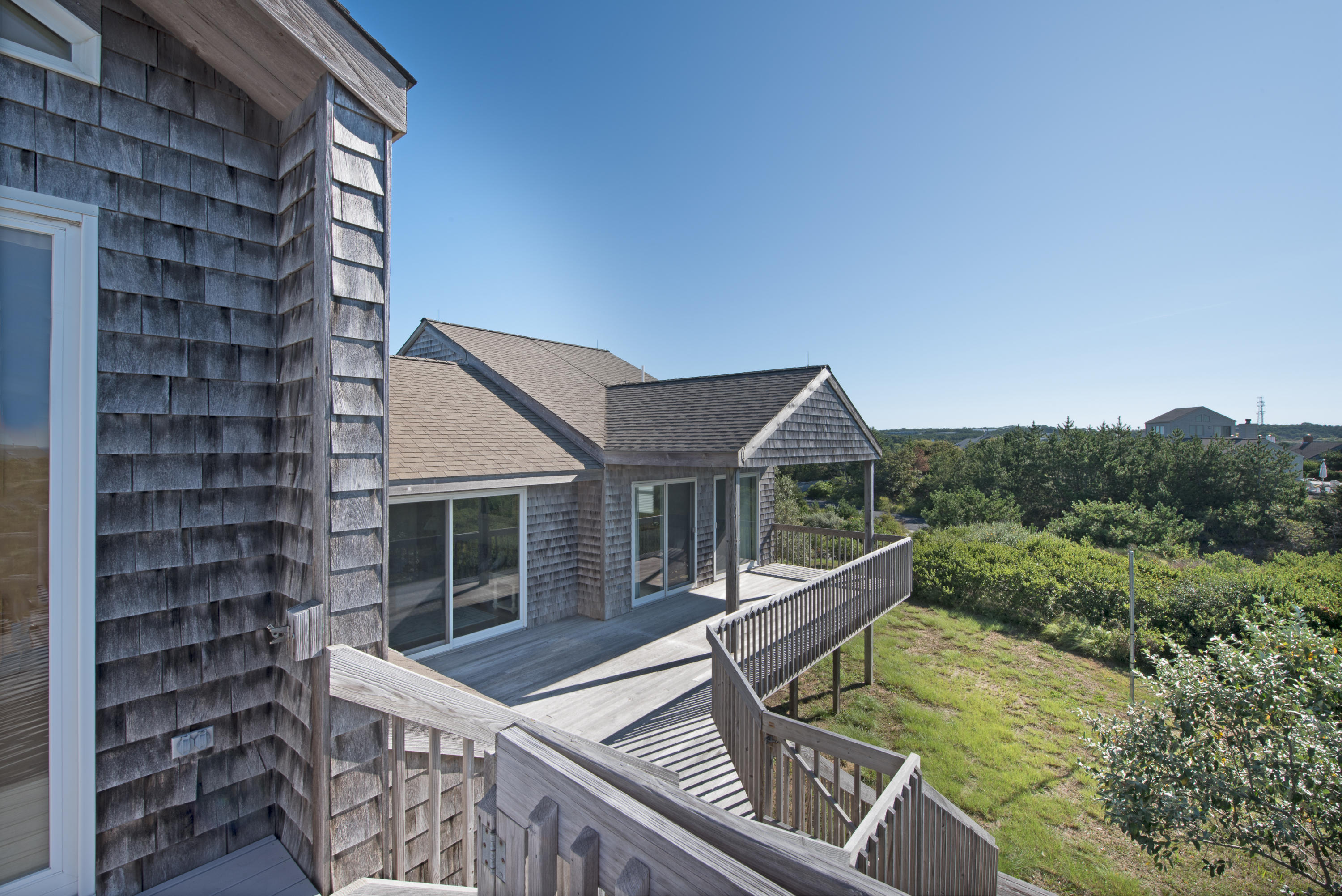 13 Avocet Road Truro, MA 02666 - Photo 5 of 35 a view of an house with backyard porch and furniture