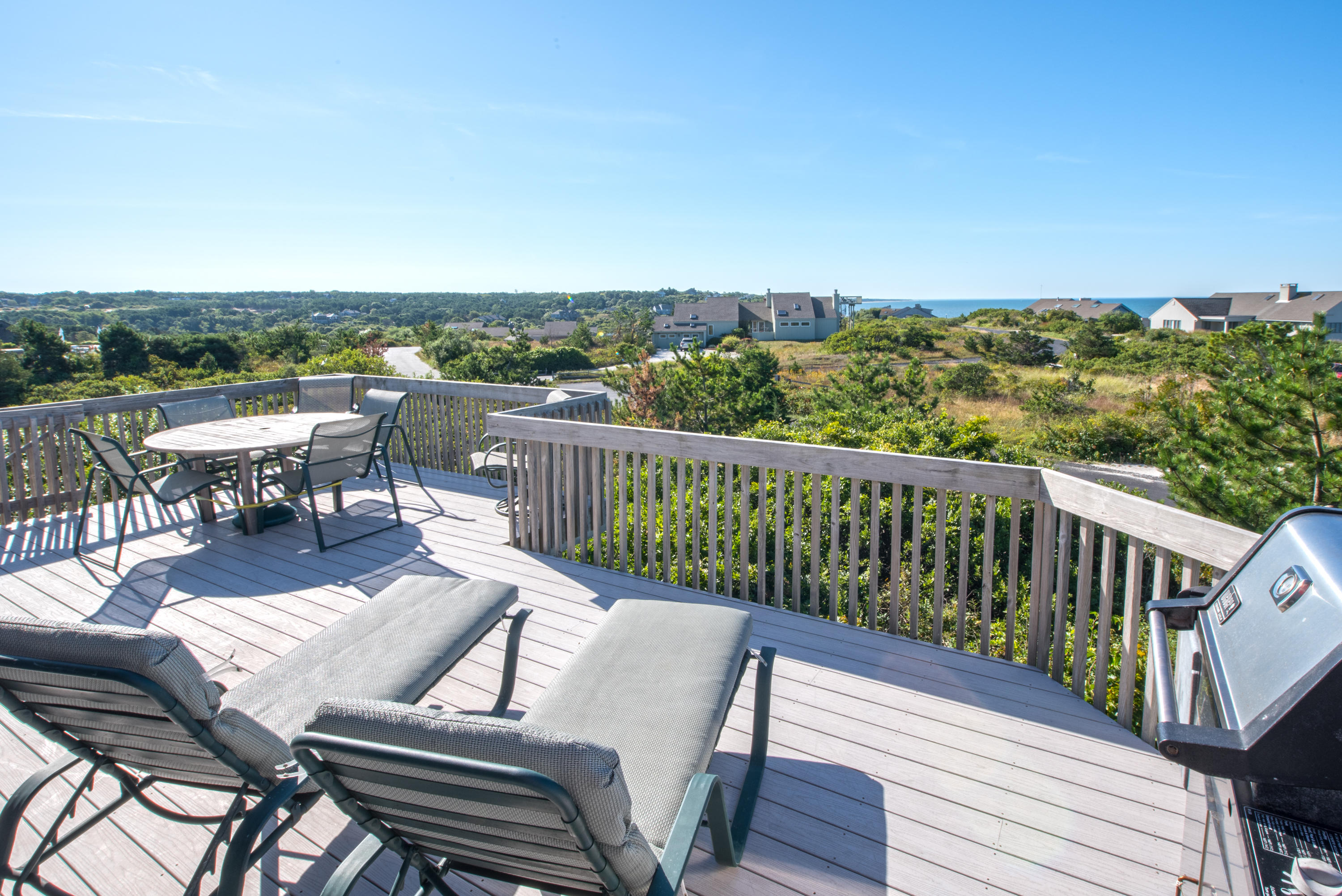 13 Avocet Road Truro, MA 02666 - Photo 9 of 35 a view of a balcony with two chairs and a table