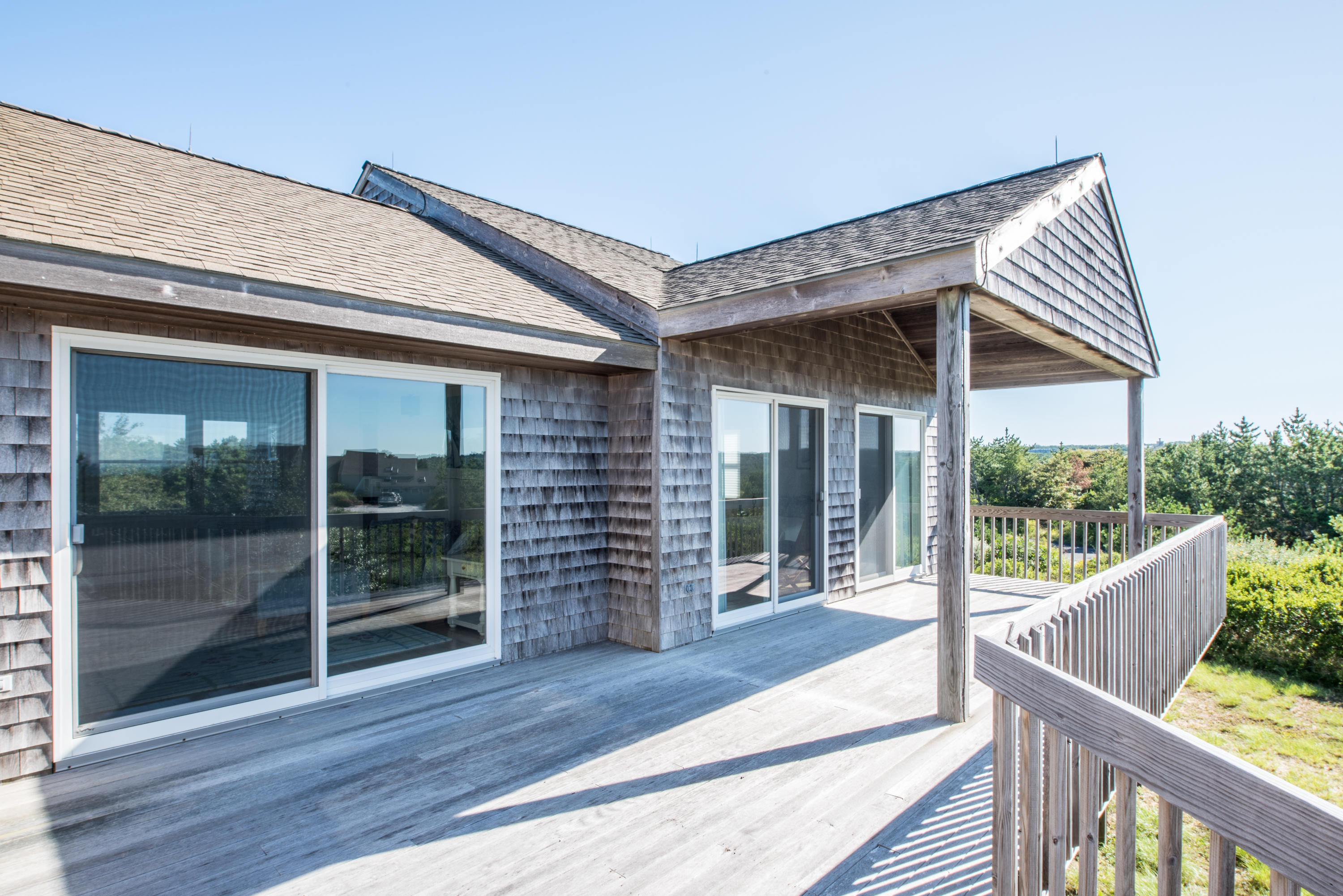 13 Avocet Road Truro, MA 02666 - Photo 10 of 35 a view of a house with porch and wooden floor