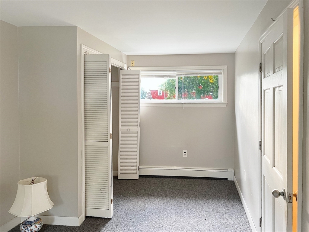 26 Wheeler Avenue, Unit 1 Rockland, MA 02370 - Photo 12 of 16 a view of an empty room with a window