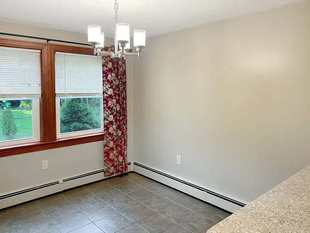 a view of entryway with window and chandelier
