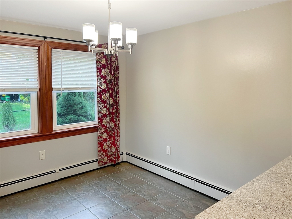 26 Wheeler Avenue, Unit 1 Rockland, MA 02370 - Photo 4 of 16 a view of entryway with window and chandelier