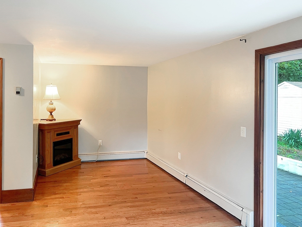 26 Wheeler Avenue, Unit 1 Rockland, MA 02370 - Photo 6 of 16 a view of empty room with wooden floor and fan