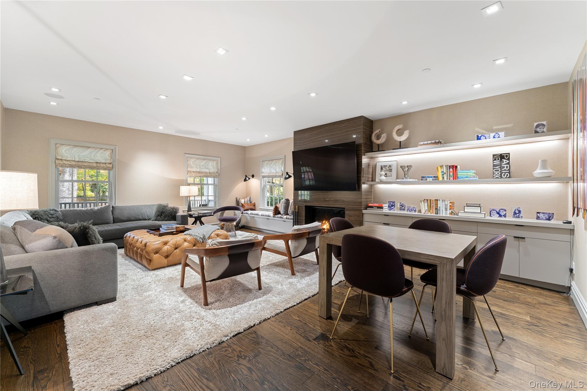 8 Richbell Road Scarsdale, NY 10583 - Photo 14 of 45 a living room with furniture a flat screen tv and kitchen view