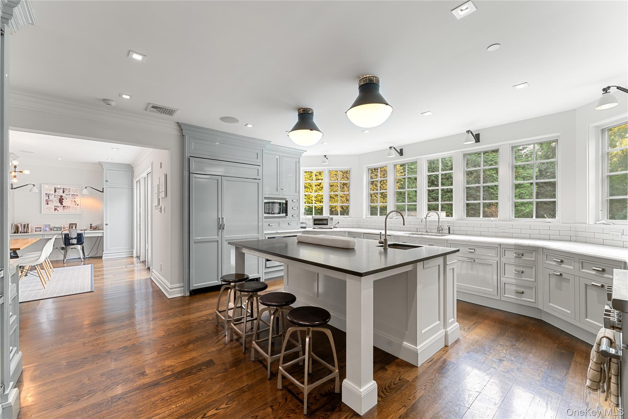 8 Richbell Road Scarsdale, NY 10583 - Photo 16 of 45 a kitchen with center island and stainless steel appliances