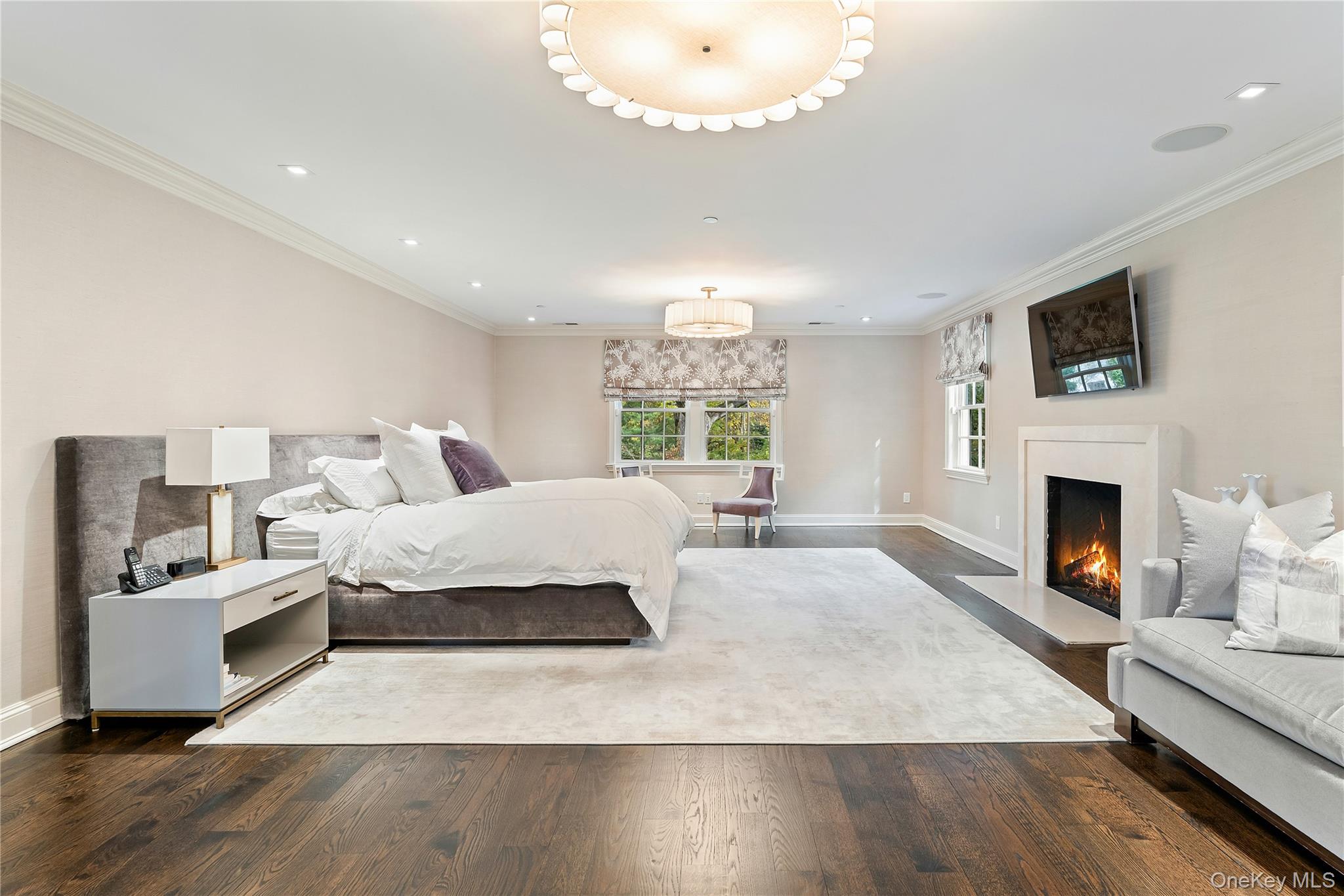8 Richbell Road Scarsdale, NY 10583 - Photo 28 of 45 a spacious bedroom with a bed and a fireplace