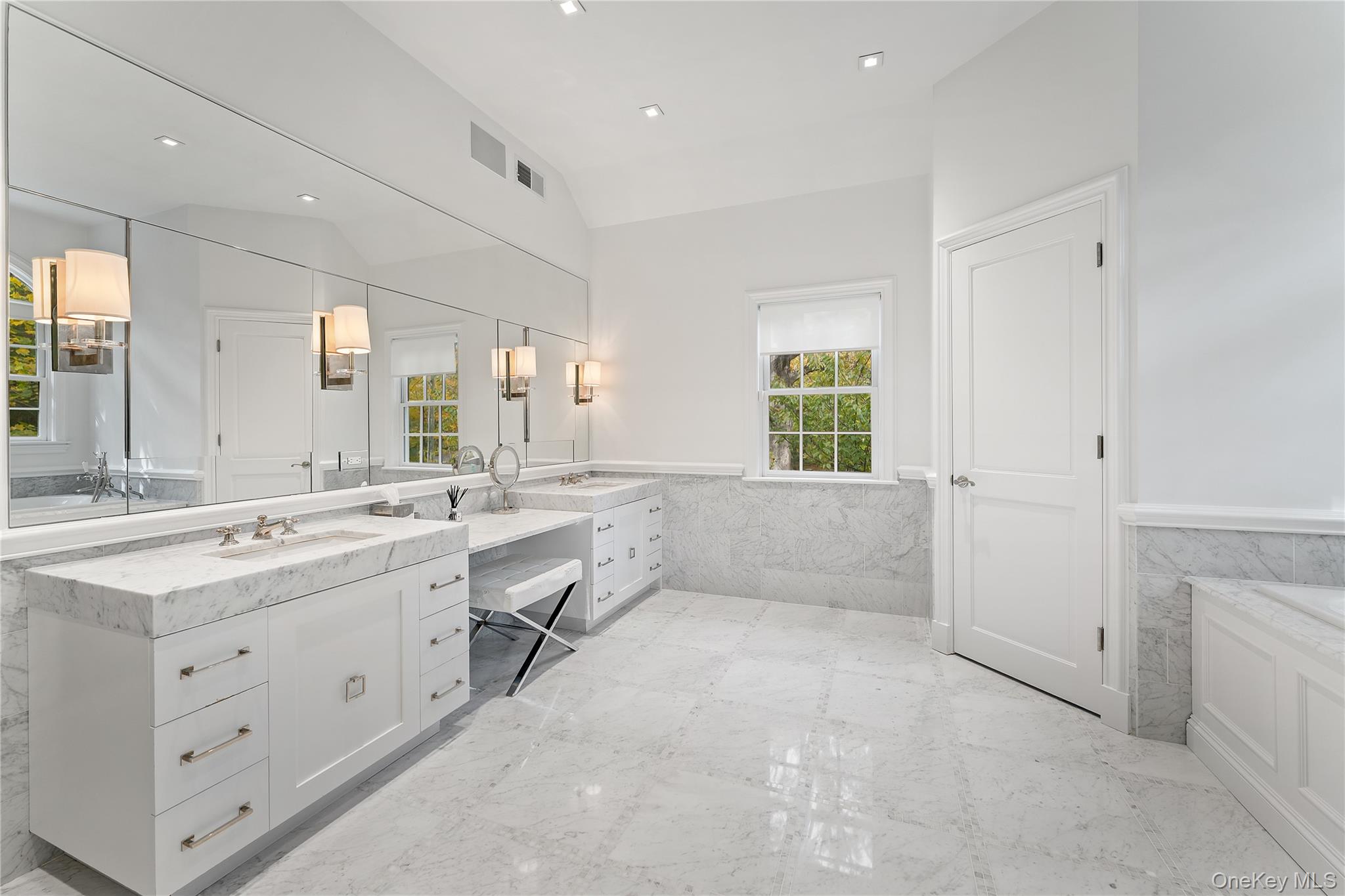 8 Richbell Road Scarsdale, NY 10583 - Photo 29 of 45 a large white bathroom with a granite countertop sink mirror and bathtub