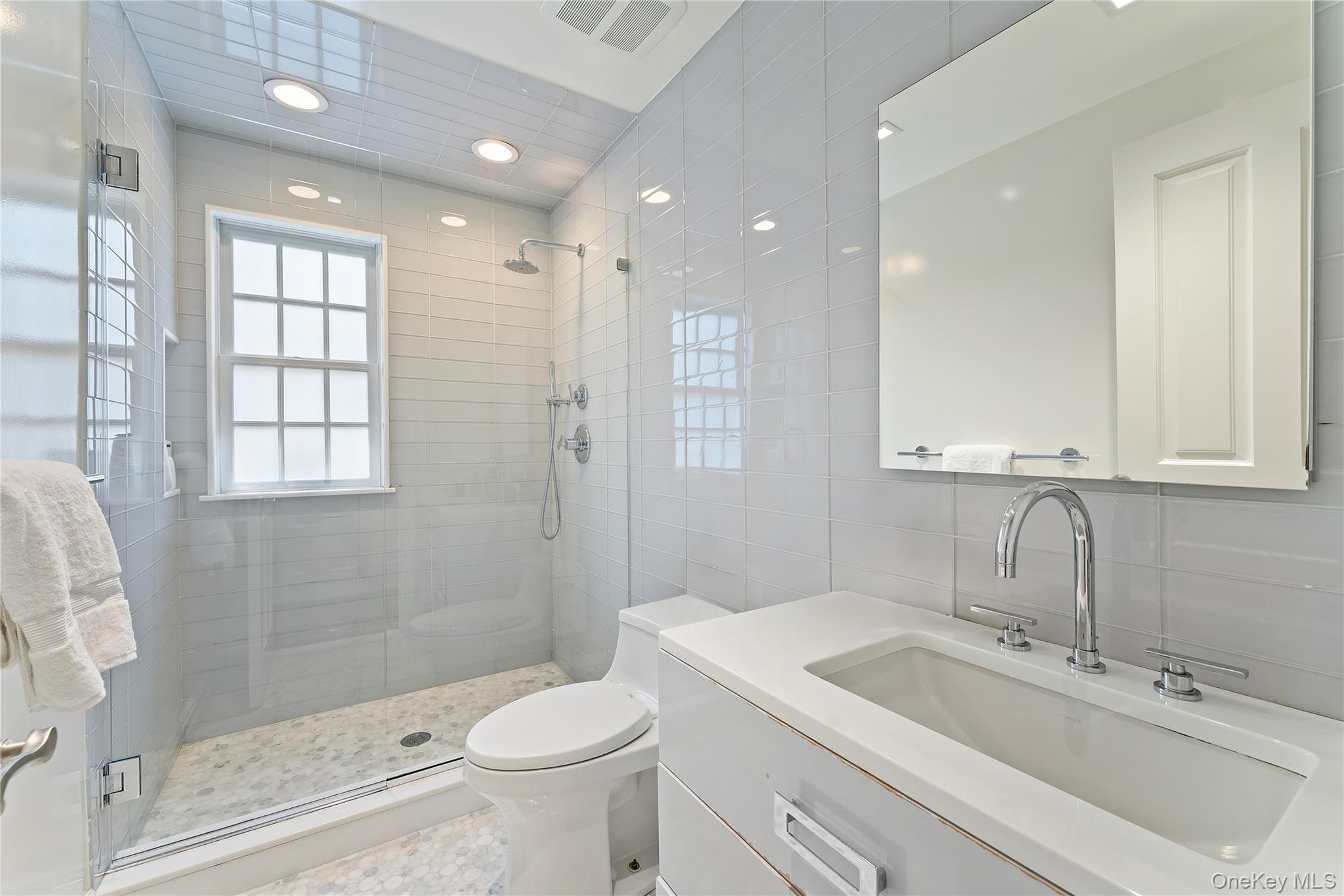 8 Richbell Road Scarsdale, NY 10583 - Photo 31 of 45 a bathroom with a sink a toilet and shower