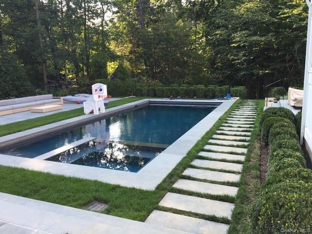 8 Richbell Road Scarsdale, NY 10583 - Photo 7 of 45 a view of a wooden deck and a yard