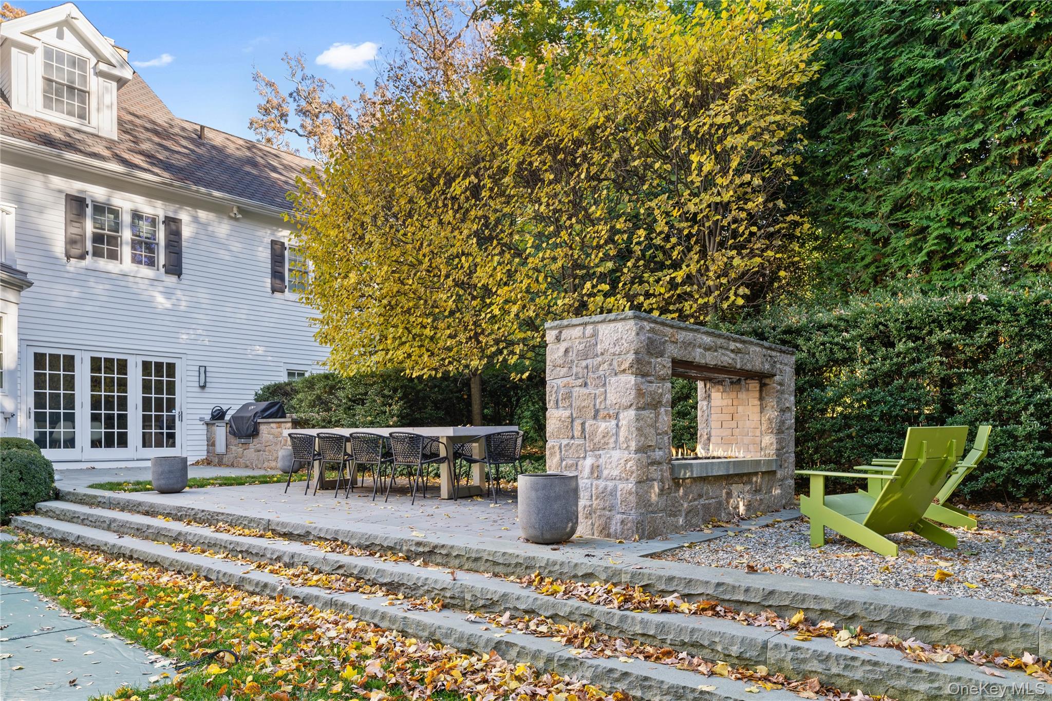 8 Richbell Road Scarsdale, NY 10583 - Photo 8 of 45 a front view of a house with garden