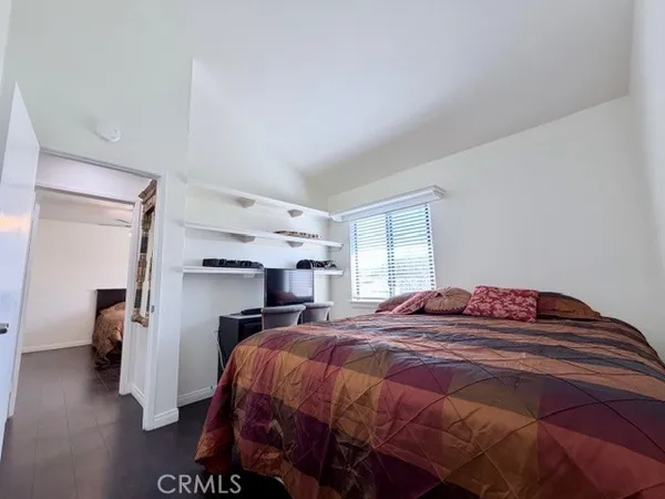 a bedroom with a bed and a walk in closet